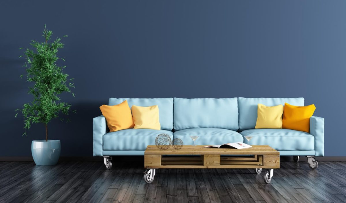 Modern interior of living room with navy blue wall, sofa, pallet table and plant 3d rendering